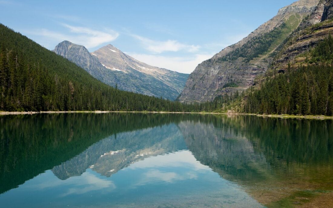 Landscape of Avalanche Lake and nearby mountains in Glacier National Park.