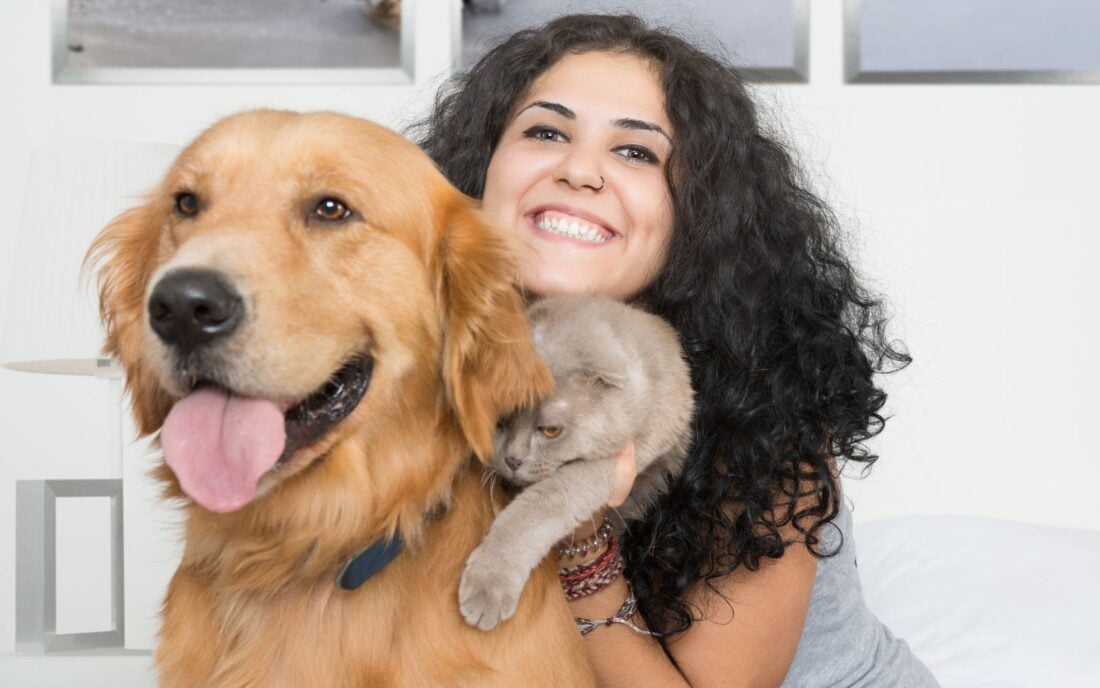 a pet sitter with a dog and cat