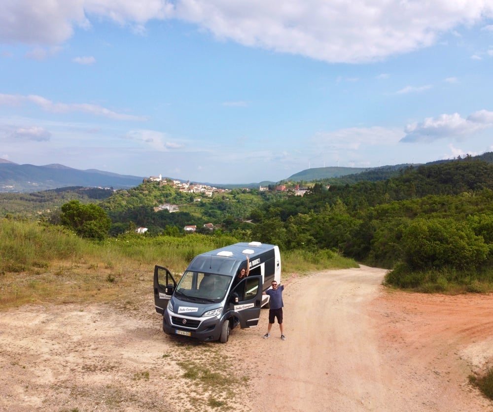 drone photo of a couple in penela with a campervan