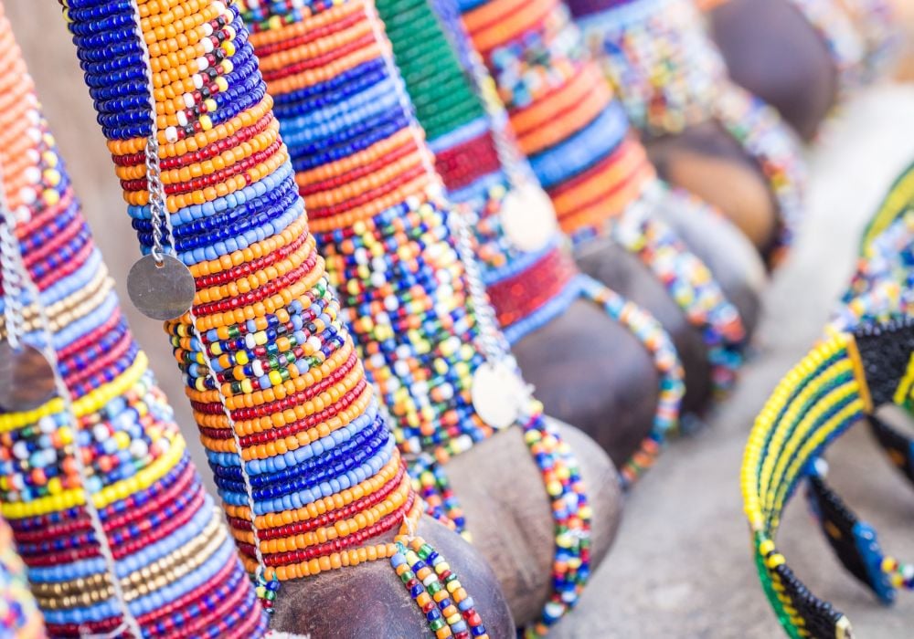 Maasai rungu decorated with beads in different colors and sold as a souvenir at a local Maasai market