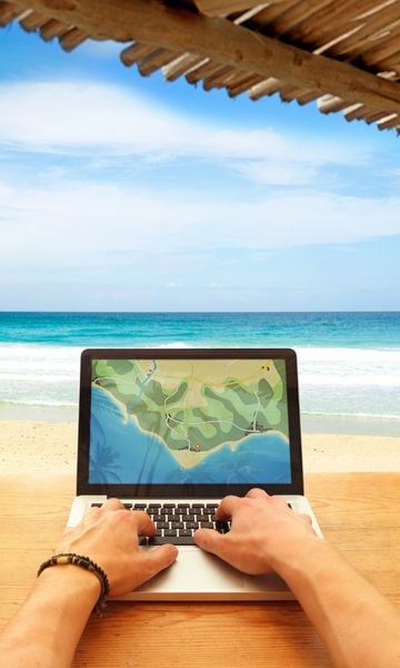 Digital Nomad Working on a Beach