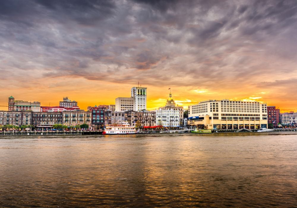 The skyline on the Savannah River at dusk with some old buildings in the area